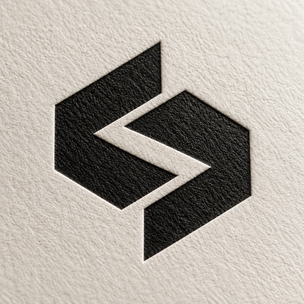 A bespoke black symbol embossed into cotton paper