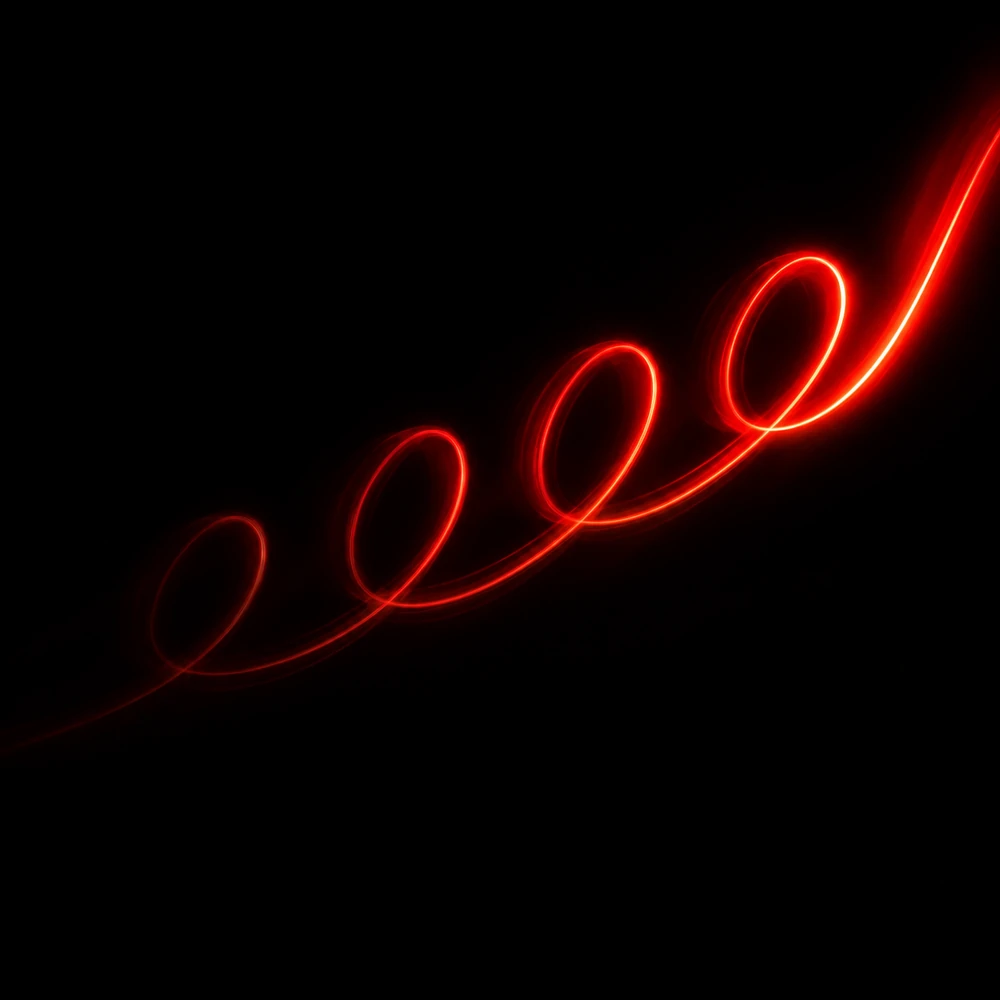 A red long-exposure light trail drawing a continuous wave